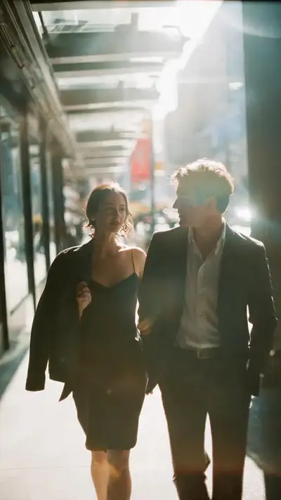 Cinematic candid film photo of a couple walking on an urban walkway