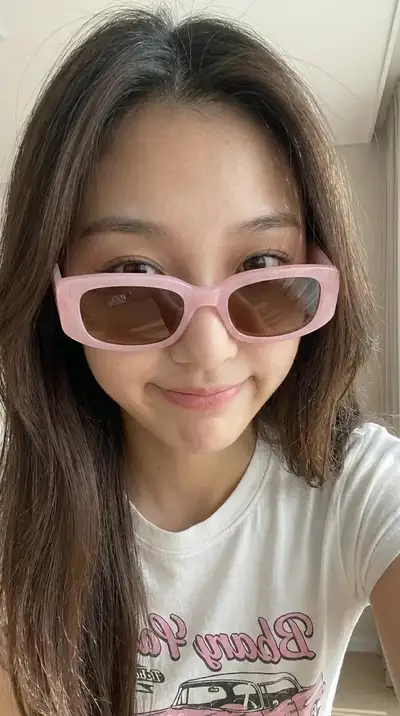 Casual Indoor Smartphone Portrait of Young East Asian Woman