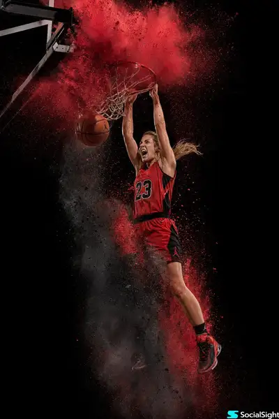 Female Basketball Player Mid-Air Dunk with Powder Explosion