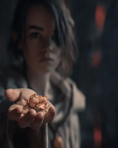 Movie Still Closeup of Woman Holding Flower