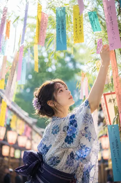 Tanabata festival portrait of a woman tying a wish strip