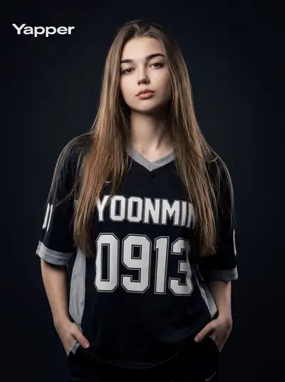 Studio portrait of a woman in a dark sports jersey