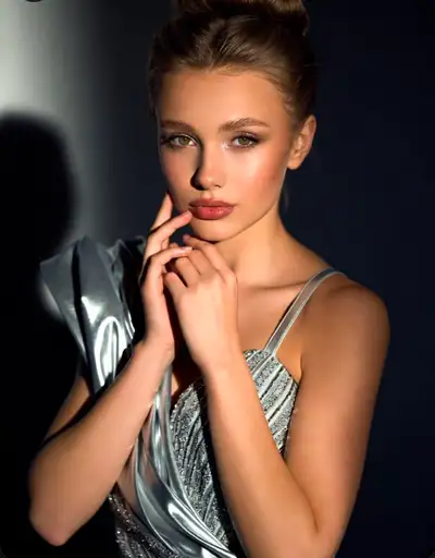 High-fashion studio portrait in silver light