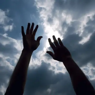 Two Hands Silhouettes Reaching to the Sky