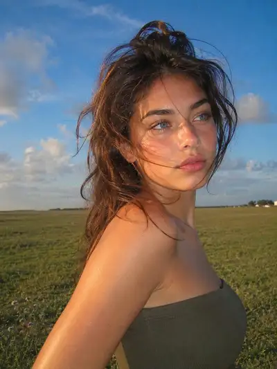 Golden-hour outdoor portrait in a meadow
