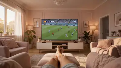 POV video from a cozy living room armchair with baby-pink decor