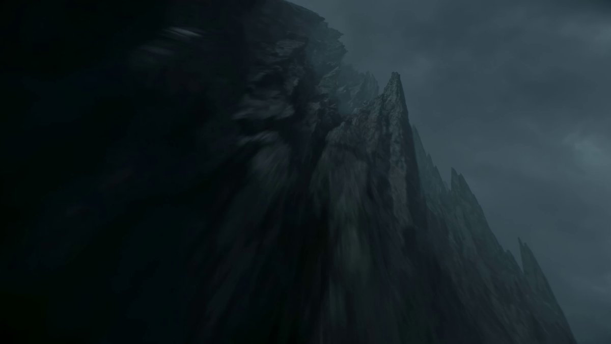 Samurai silhouetted at a cliff edge above a stormy sea