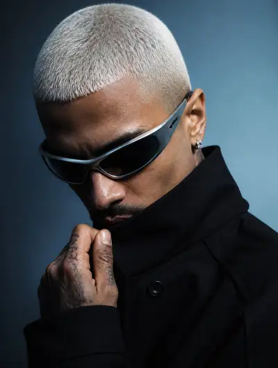 Cyber inspired fashion portrait with metallic sunglasses and light