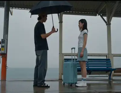 Rainy train-station goodbye - cinematic Seedance prompt