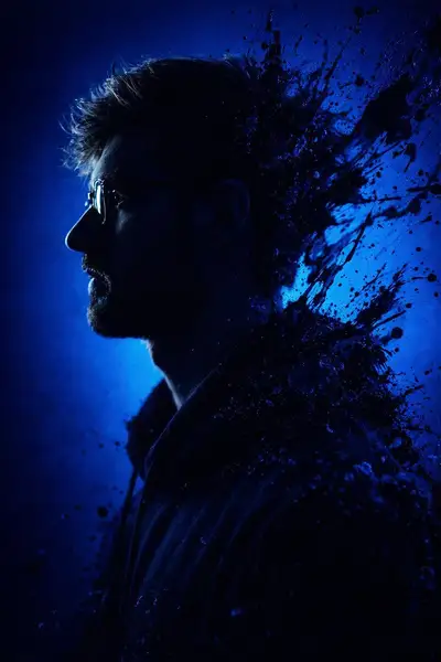 Silhouette portrait with sapphire paint splash burst