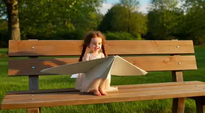 Miniature Girl in Paper Airplane Launch