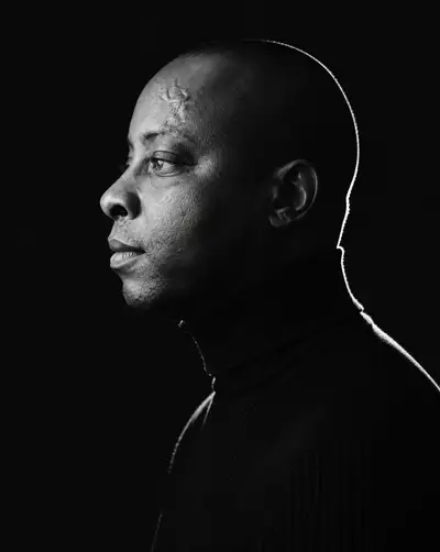 Minimalist black and white side-profile portrait