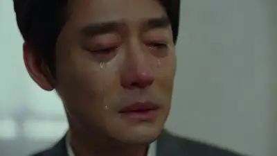 Asian Man Holding Back Tears