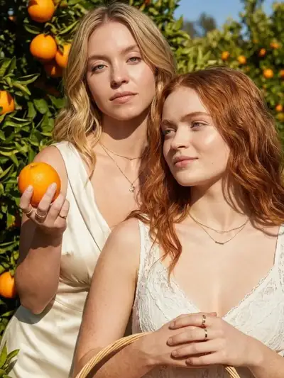 Cinematic Photo of Two Women in an Orange Grove