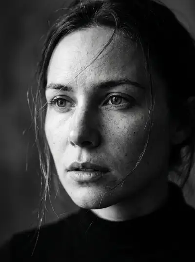 Black and white chiaroscuro close-up portrait from a reference photo