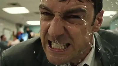 Slow-motion extreme close-up on a man's face mid-lunge, handheld
