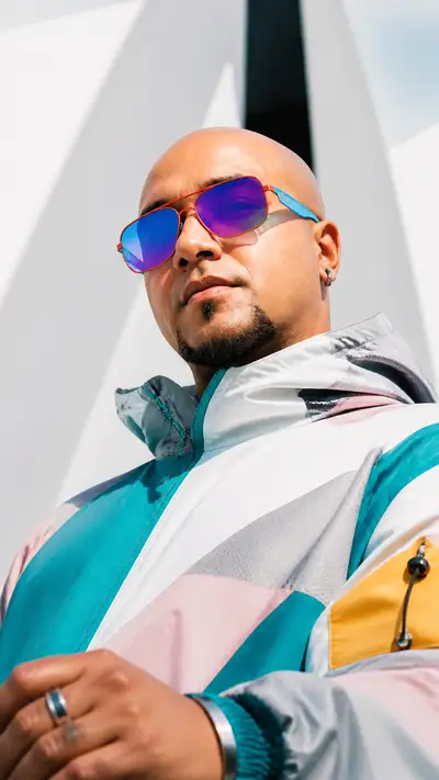 Futuristic cyber-luxury portrait with iridescent sunglasses