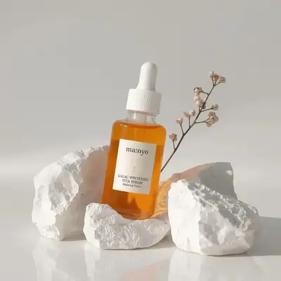 Minimalist skincare serum bottle product photography