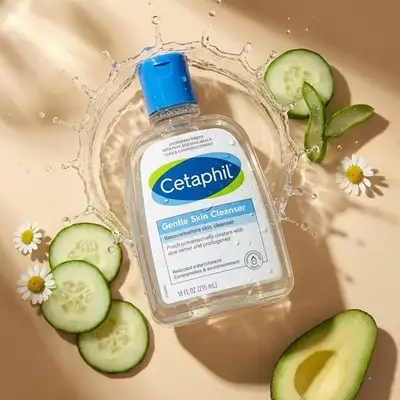 Skincare product flat lay with water splash and ingredients
