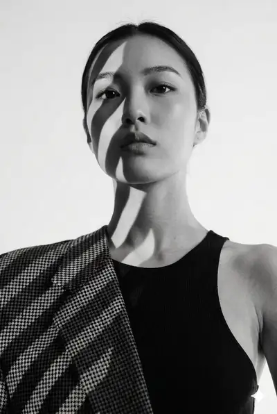 Minimalist Fashion Portrait with Dramatic Shadows