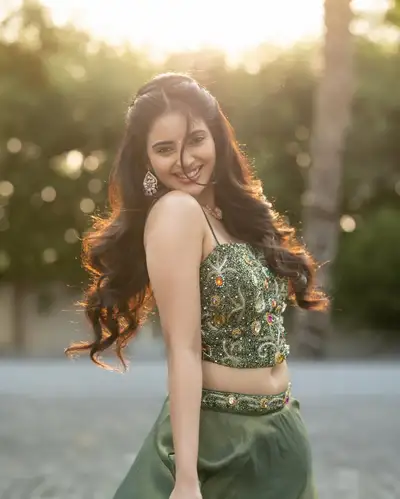 Indian Woman in Emerald Lehenga at Sunset