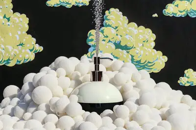 Flying White Spray Cosmetic Mockup on Bubbly Orbs