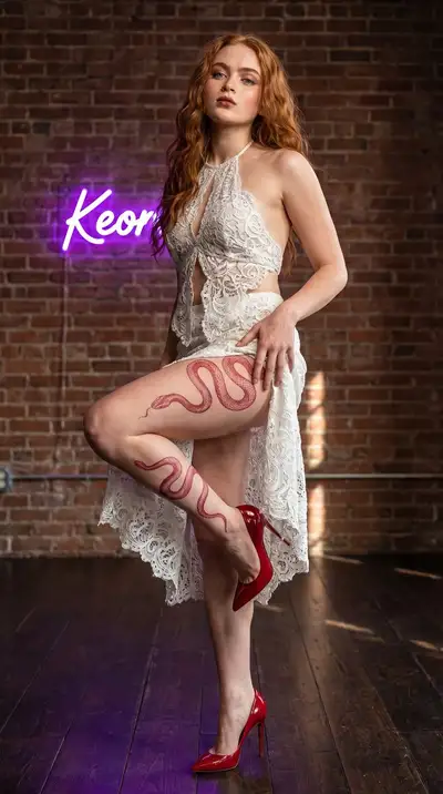 Vertical Shot of Redhead Woman with Neon Sign
