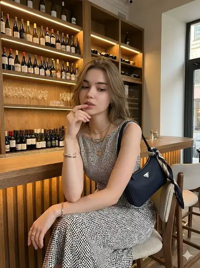 Chic wine bar portrait in a polka dot midi dress