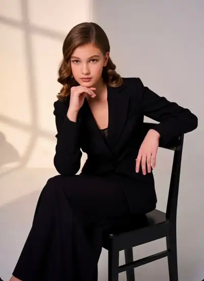 Elegant Studio Portrait of a Woman in Black Suit