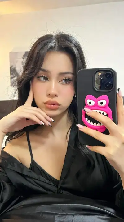 Mirror Selfie Portrait on Black Satin Bed