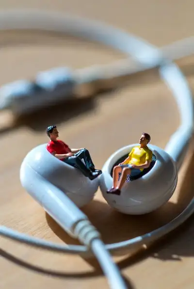 Ultra-Realistic Macro Photo of Tiny People in Earbuds