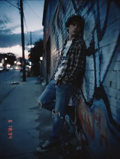 Grunge street portrait with film grain and date stamp