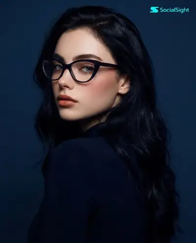 Dramatic Studio Portrait with Cat-Eye Glasses and Blue Backdrop