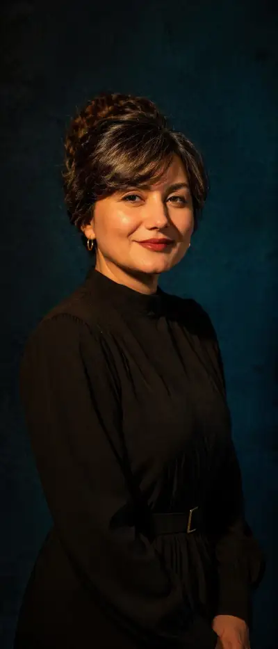 High-contrast studio portrait with teal and gold lighting