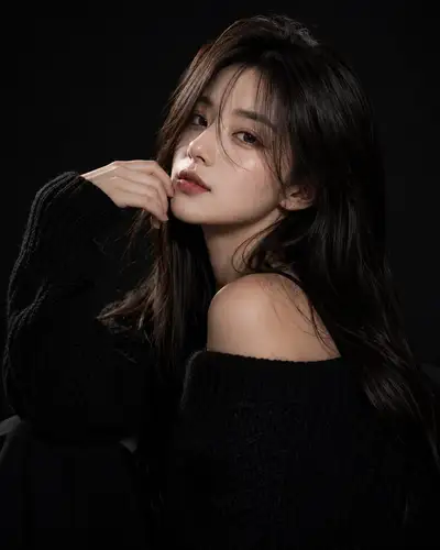 Moody studio beauty portrait in an oversized knit sweater