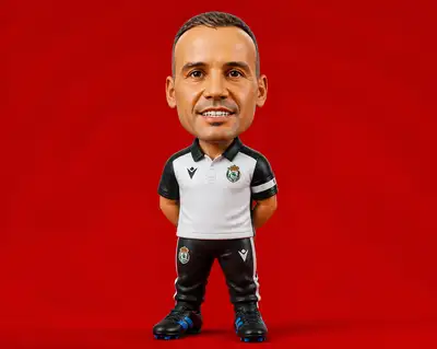 Chibi collector figurine of a football coach in club kit