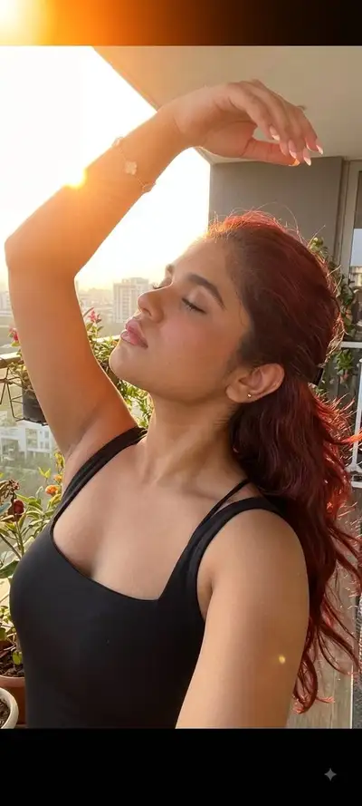 Sunlit Balcony Selfie with Halo Effect