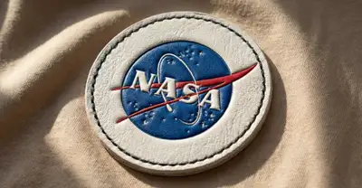 Macro photo of an embossed logo on a stitched leather patch