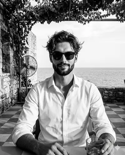 Black and white coastal editorial portrait of a man