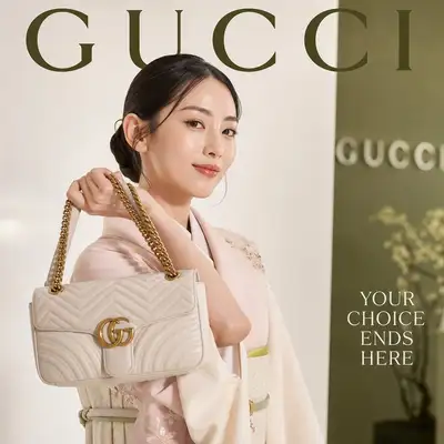 Gucci luxury magazine cover with handbag showcase