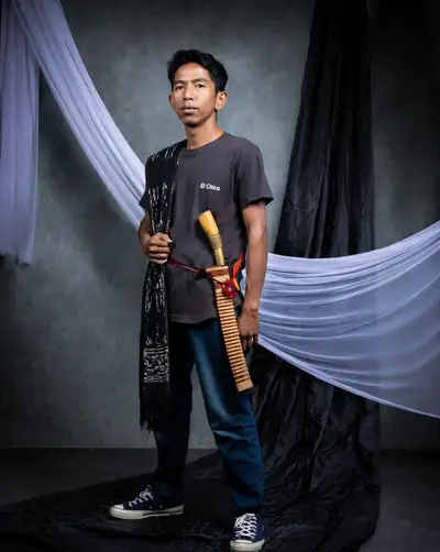 Studio portrait of a man with a traditional ceremonial blade