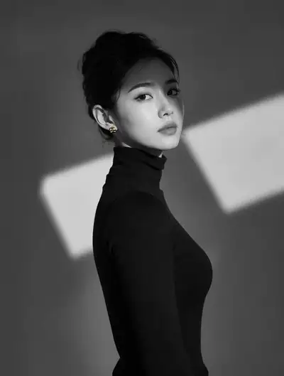 Monochrome studio portrait woman with Korean bun