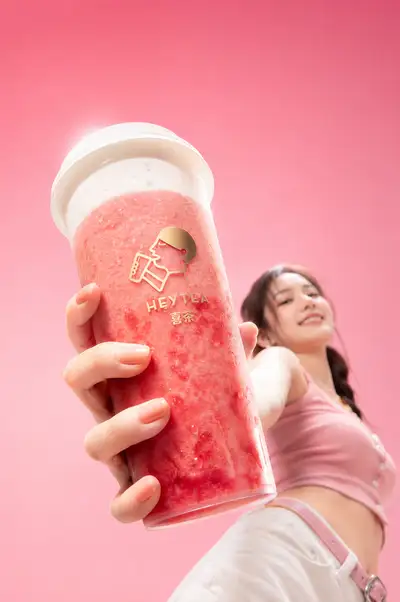 Extreme low-angle drink ad with pink gradient