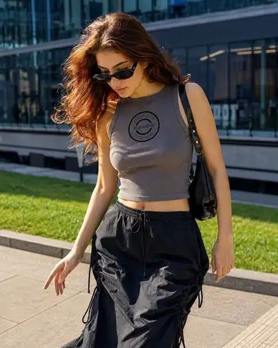 Golden hour street-style portrait with auburn hair and sunglasses