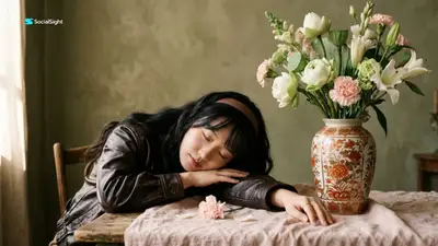 Fine art studio portrait beside a floral ceramic vase