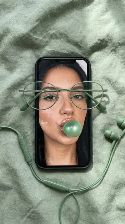 Sage-Green Flat Lay Product Photography with Phone and Glasses