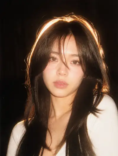 Nostalgic 90s flash-lit film portrait, dark background