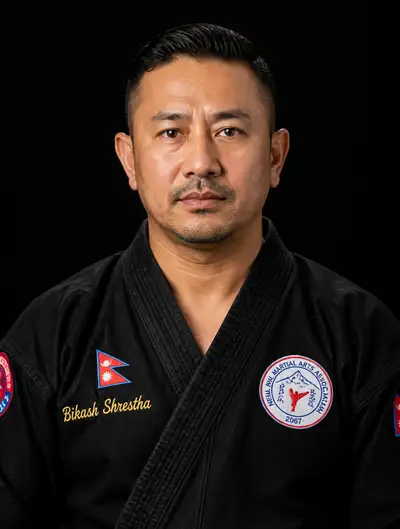 Studio portrait of martial artist in embroidered gi with Nepali flag patch
