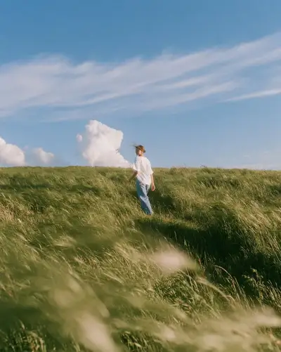 Cinematic wheat field portrait in golden late morning light
