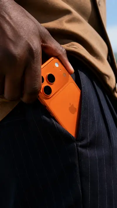 Close-up hand tucking smartphone into pocket